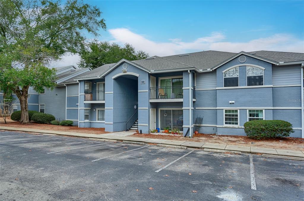 3705 Southwest 27th Street, Unit 926 Gainesville, FL 32608 - Photo 7 of 39 a front view of a house with a yard
