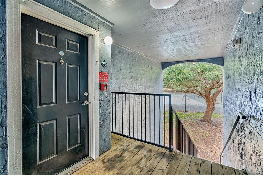 3705 Southwest 27th Street, Unit 926 Gainesville, FL 32608 - Photo 8 of 39 a stairs and a window in an empty room