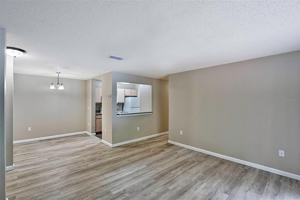 3705 Southwest 27th Street, Unit 926 Gainesville, FL 32608 - Photo 10 of 39 a view of wooden floor and windows in a room