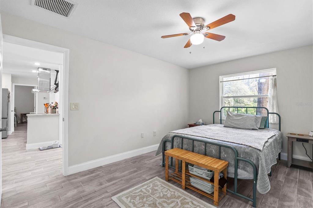 6244 Colony Circle Weeki Wachee, FL 34607 - Photo 46 of 60 a bedroom with a bed table and a window