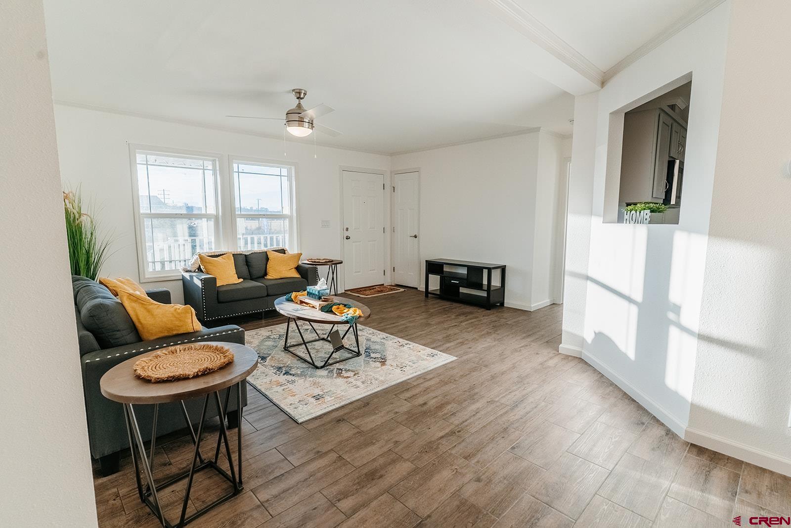 62650 Lasalle Road, Unit 325 Montrose, CO 81403 - Photo 13 of 24 a living room with furniture and a table