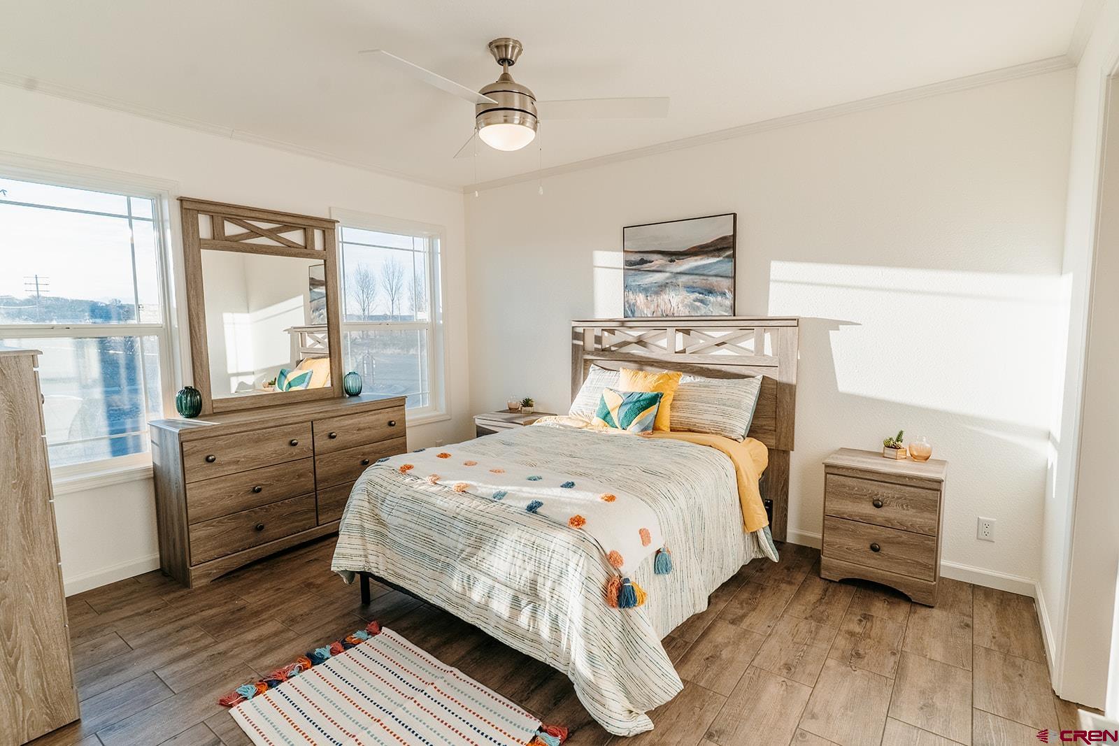 62650 Lasalle Road, Unit 325 Montrose, CO 81403 - Photo 15 of 24 a bedroom with a bed and a large window