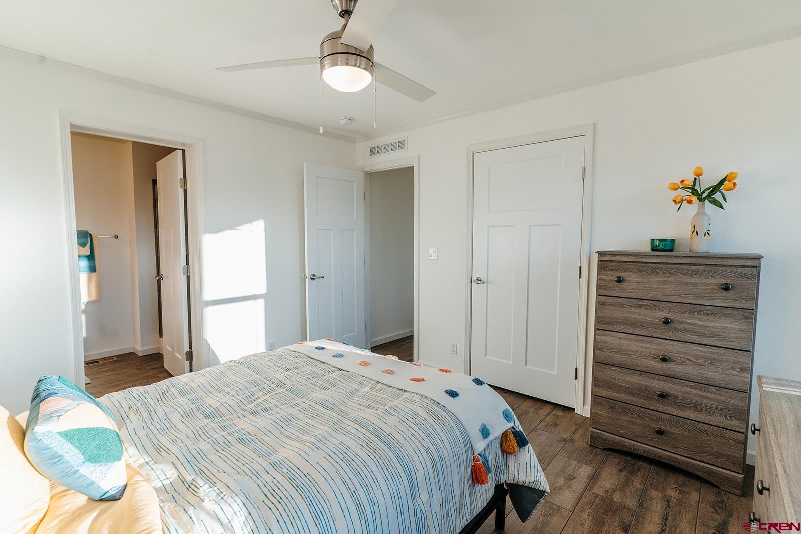 62650 Lasalle Road, Unit 325 Montrose, CO 81403 - Photo 16 of 24 a bedroom with a bed and a dresser