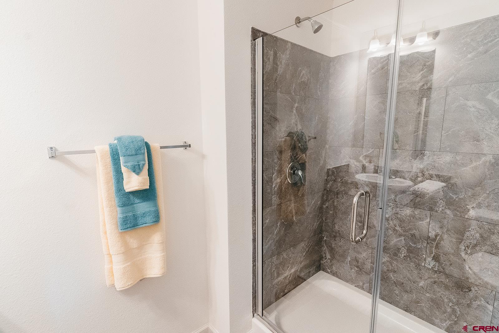 62650 Lasalle Road, Unit 325 Montrose, CO 81403 - Photo 2 of 24 a bathroom with a shower