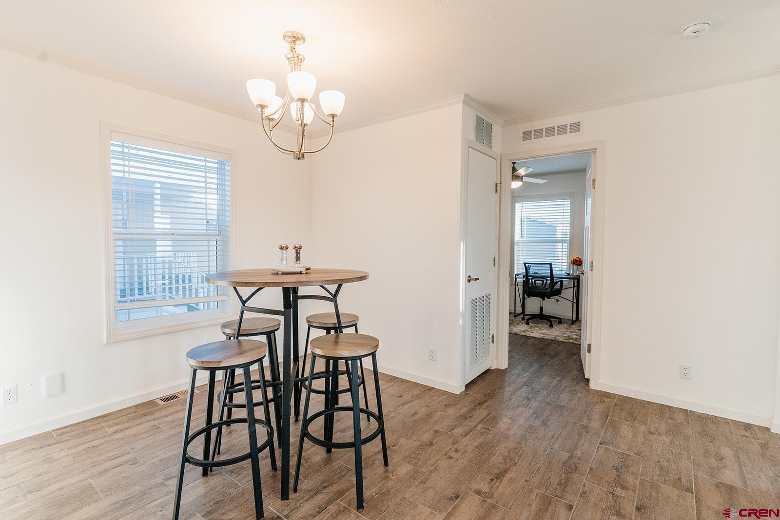62650 Lasalle Road, Unit 325 Montrose, CO 81403 - Photo 3 of 24 a view of a dining room with furniture and window