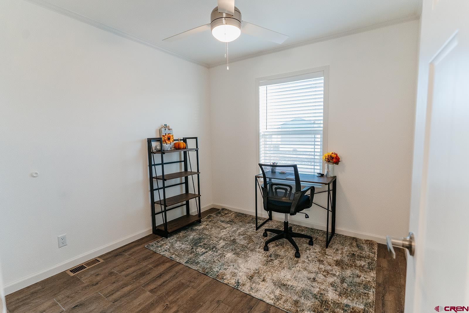 62650 Lasalle Road, Unit 325 Montrose, CO 81403 - Photo 4 of 24 a view of a workspace with furniture and a window
