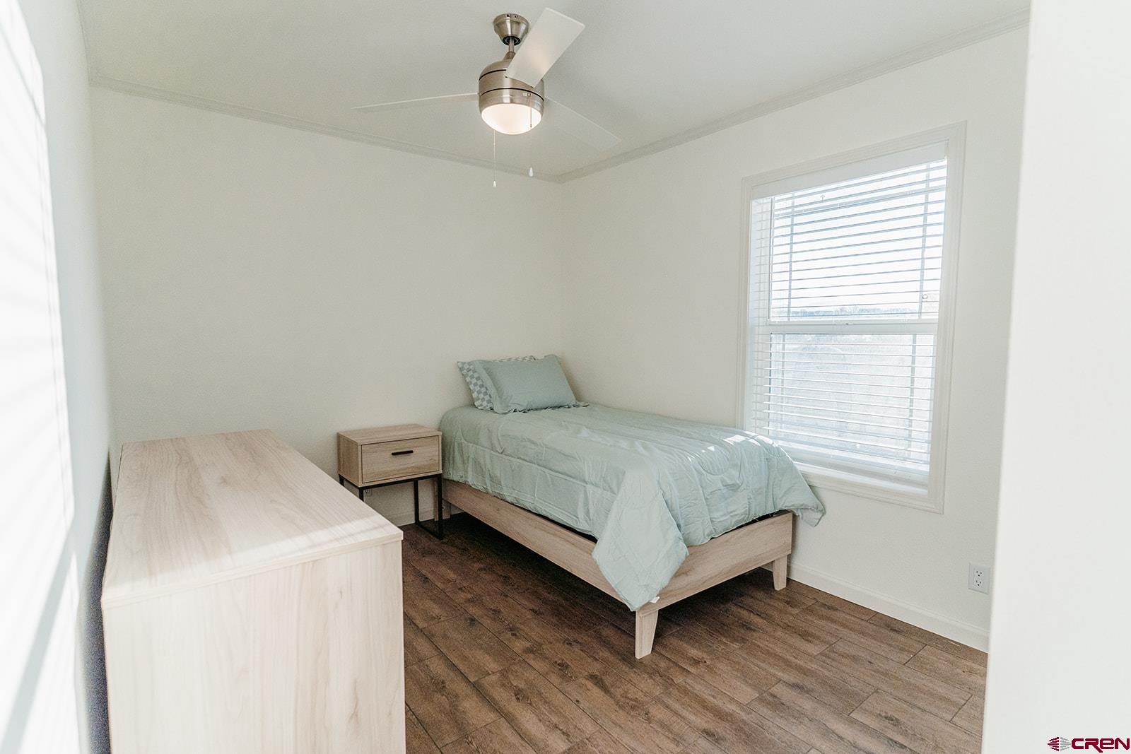 62650 Lasalle Road, Unit 325 Montrose, CO 81403 - Photo 5 of 24 a bedroom with a bed and window