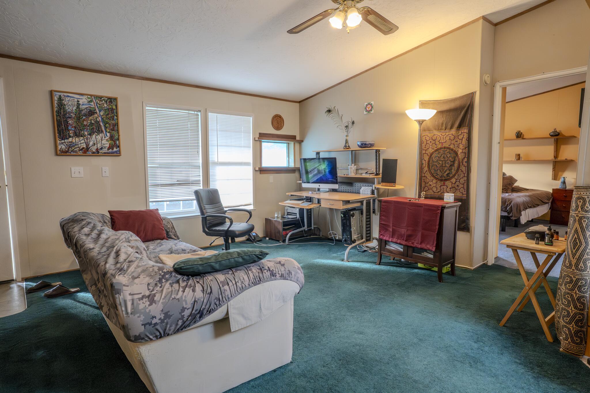 362 Humbug Creek Road Jacksonville, OR 97530 - Photo 15 of 49 a living room with furniture and a large window