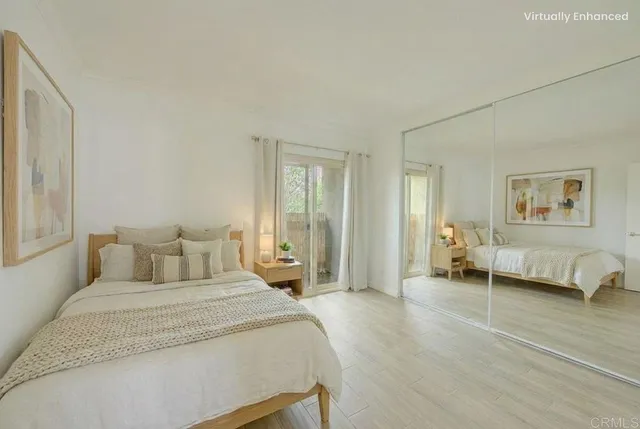 a bedroom with a bed and a couch