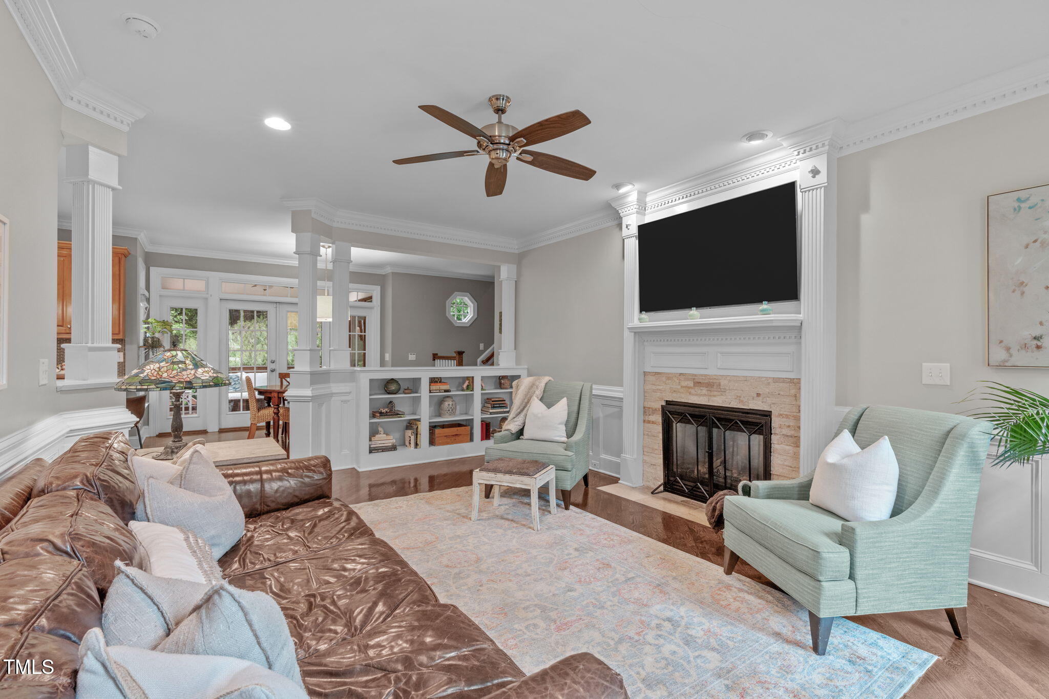 7929 Pine Timber Drive Raleigh, NC 27613 - Photo 11 of 53 a living room with furniture a fireplace and a flat screen tv