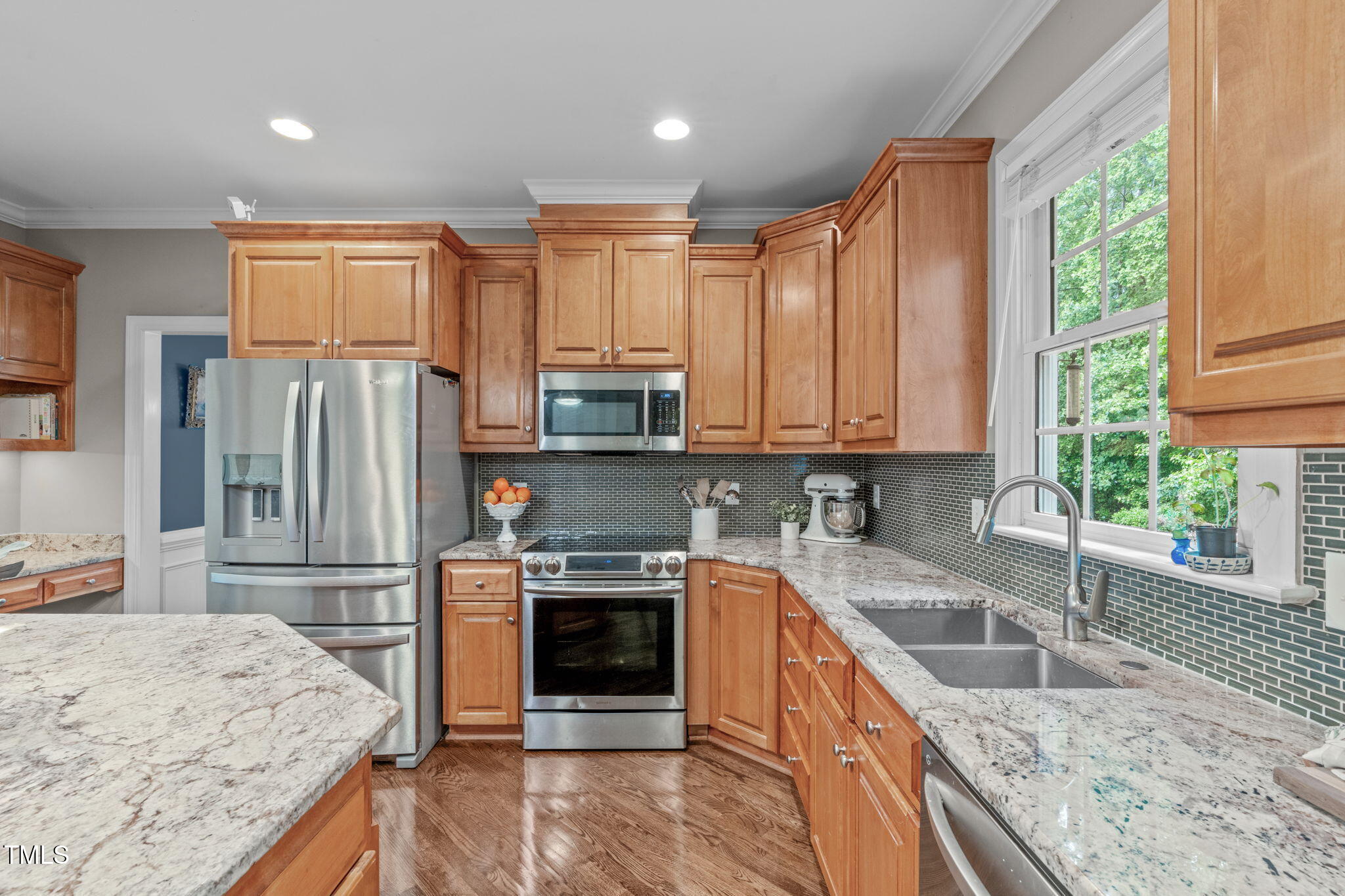 7929 Pine Timber Drive Raleigh, NC 27613 - Photo 13 of 53 a kitchen with stainless steel appliances granite countertop a sink stove and refrigerator
