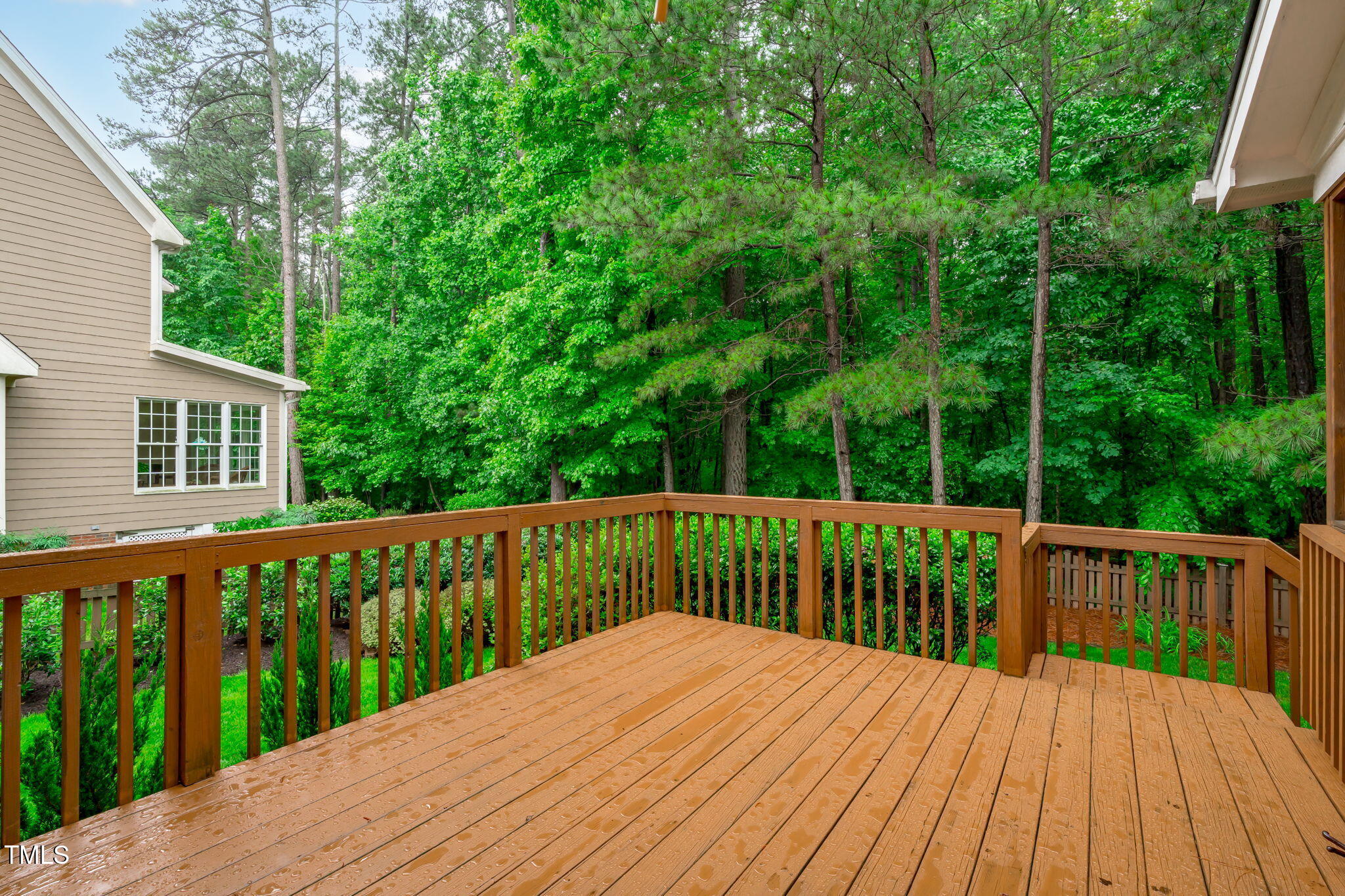 7929 Pine Timber Drive Raleigh, NC 27613 - Photo 22 of 53 a view of wooden deck and a garden