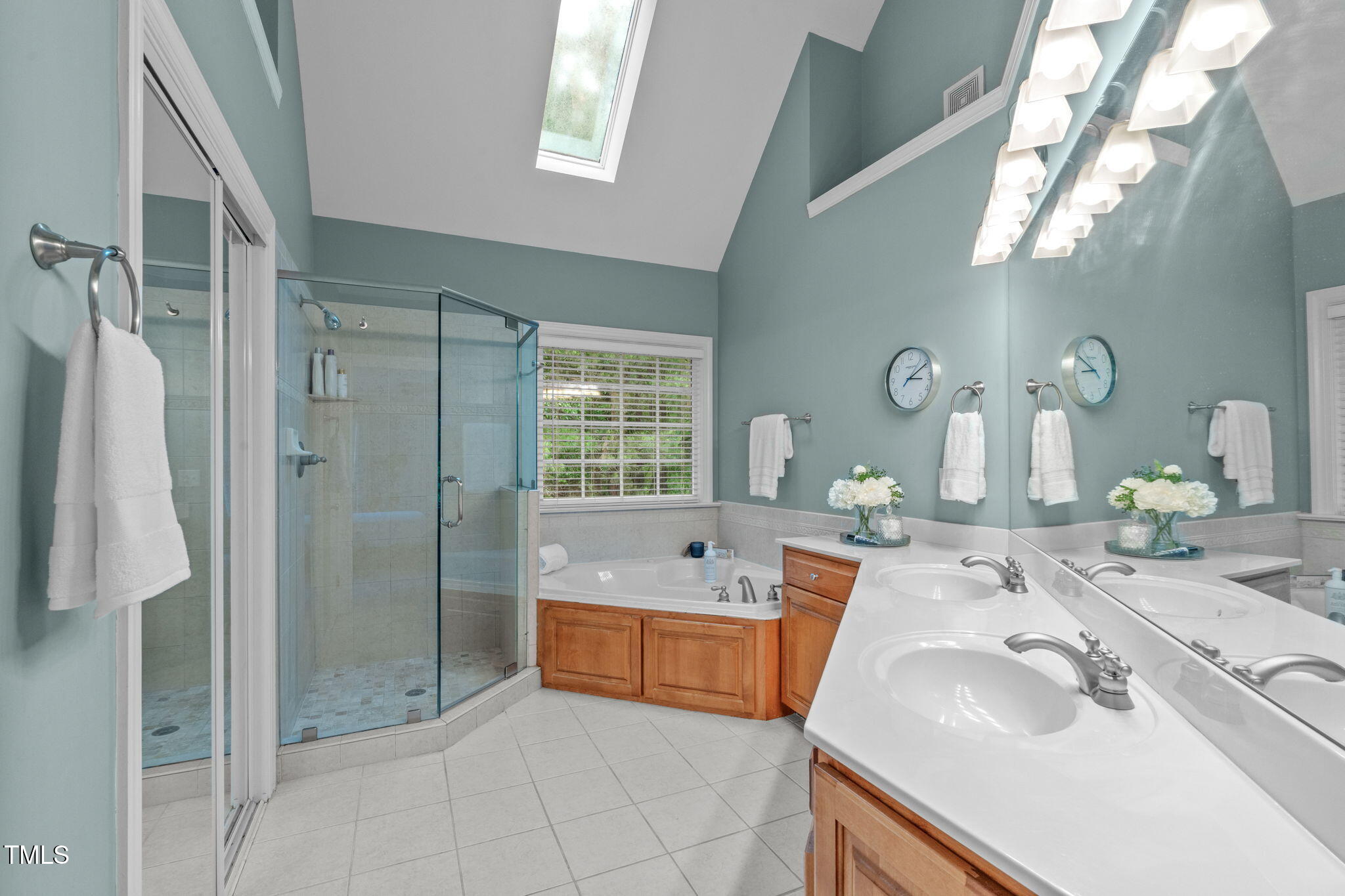 7929 Pine Timber Drive Raleigh, NC 27613 - Photo 29 of 53 a bathroom with a tub sink and mirror
