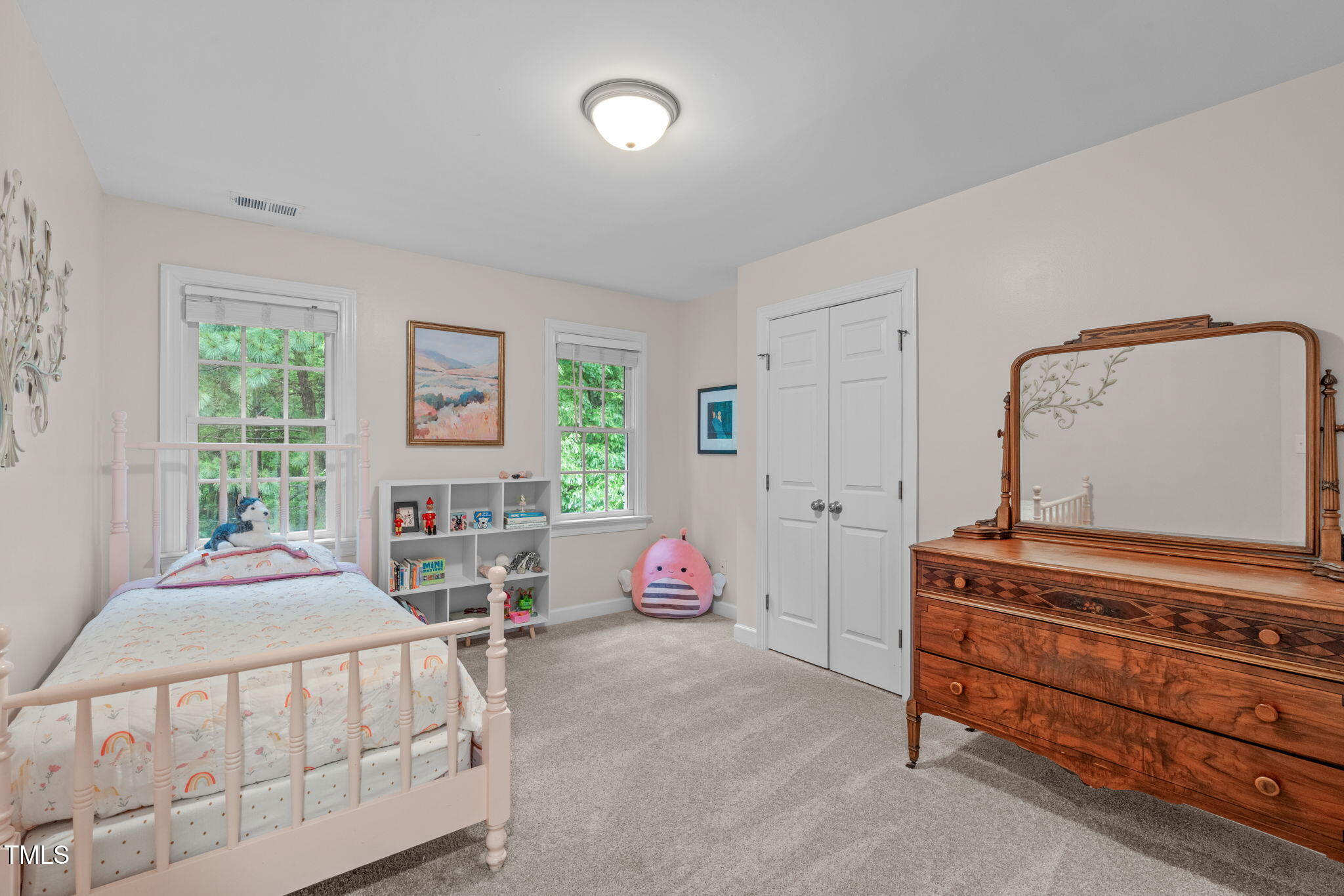 7929 Pine Timber Drive Raleigh, NC 27613 - Photo 34 of 53 a bedroom with a bed and window