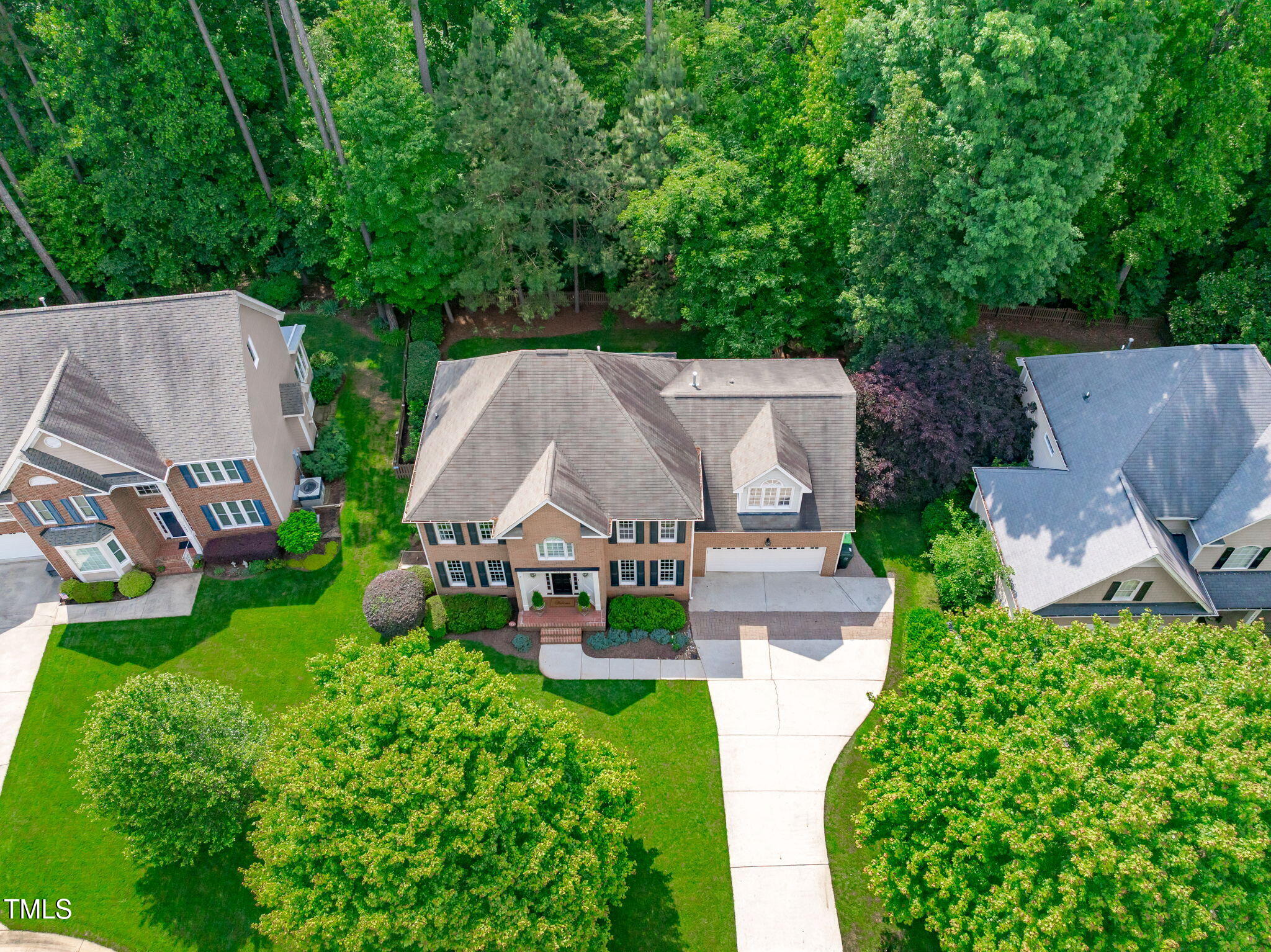 7929 Pine Timber Drive Raleigh, NC 27613 - Photo 41 of 53 an aerial view of a house with garden space and a bench