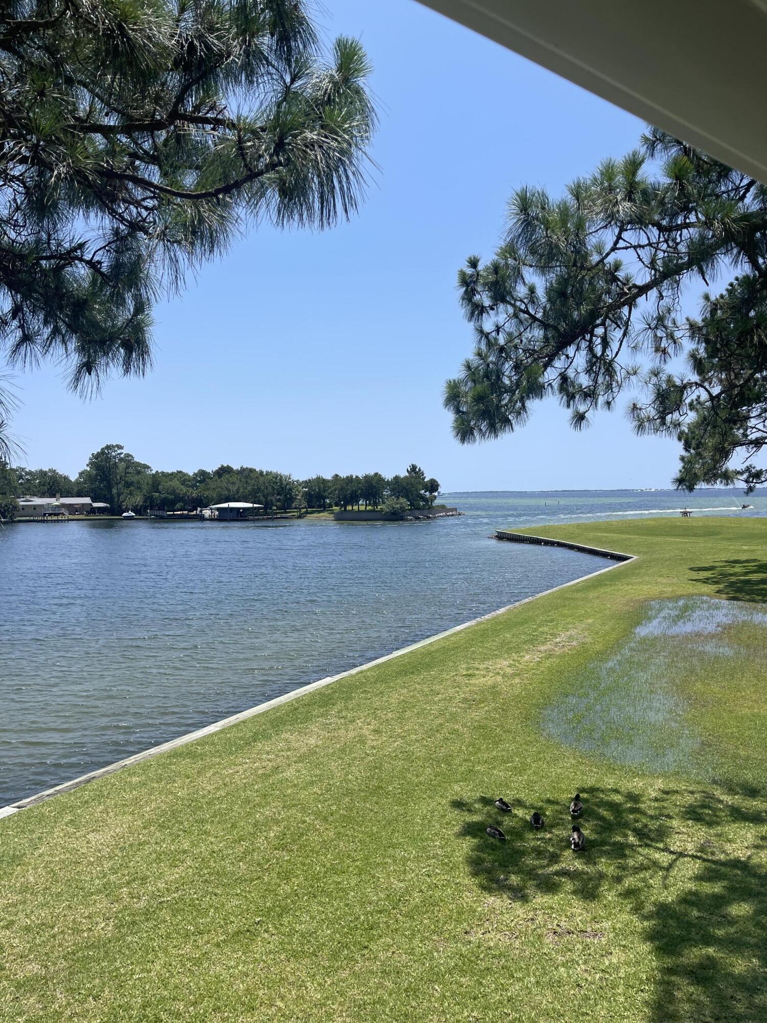 101 Old Ferry Road, Unit 29C Shalimar, FL 32579 - Photo 17 of 30 a view of a lake with a yard