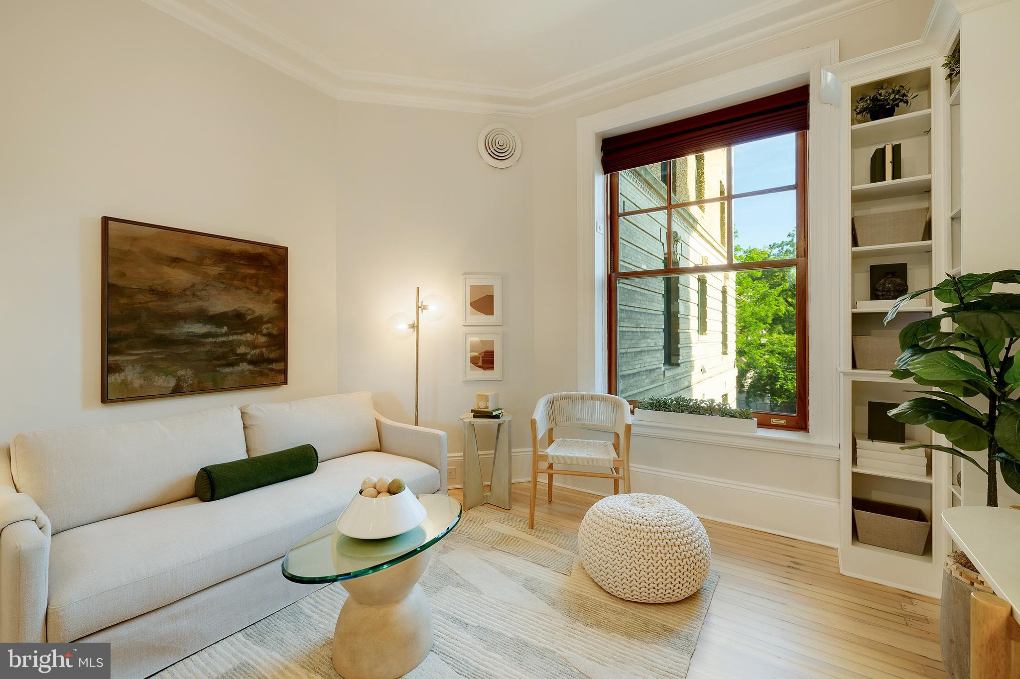 2853 Ontario Road Northwest, Unit 107 Washington, DC 20009 - Photo 13 of 39 a living room with furniture and a large window