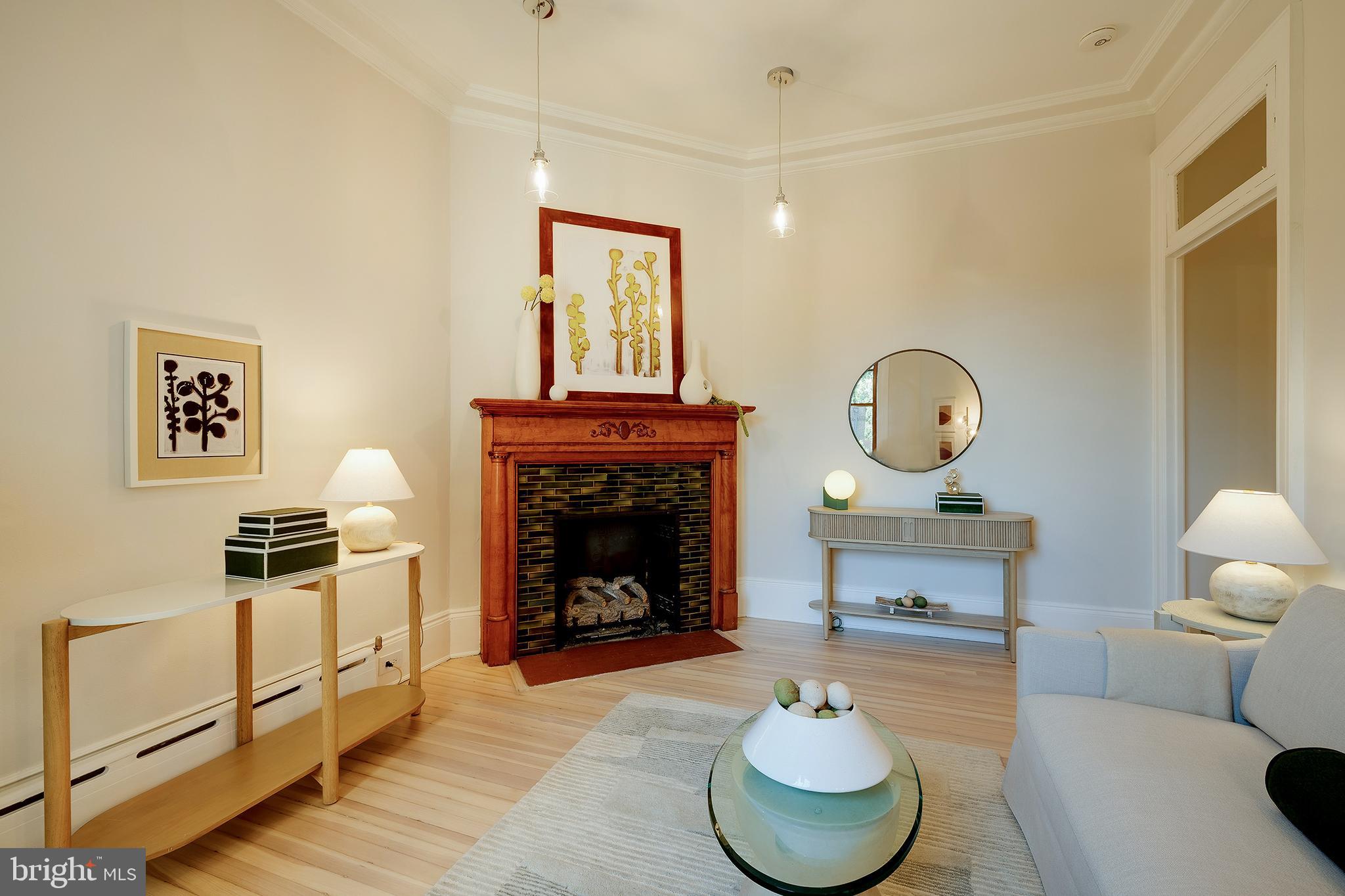 2853 Ontario Road Northwest, Unit 107 Washington, DC 20009 - Photo 14 of 39 a living room with furniture and a fireplace