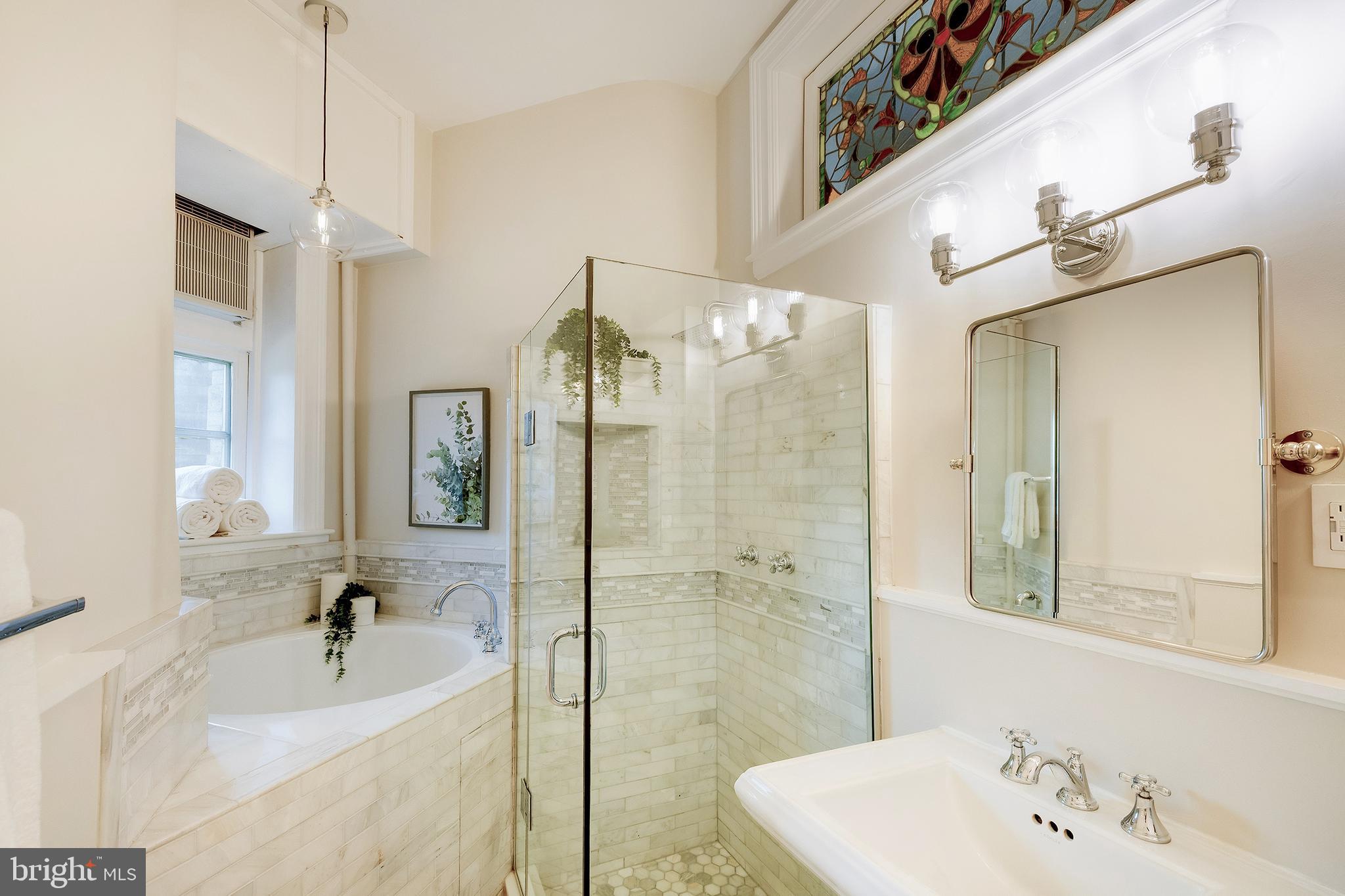 2853 Ontario Road Northwest, Unit 107 Washington, DC 20009 - Photo 21 of 39 a bathroom with a bathtub and a sink