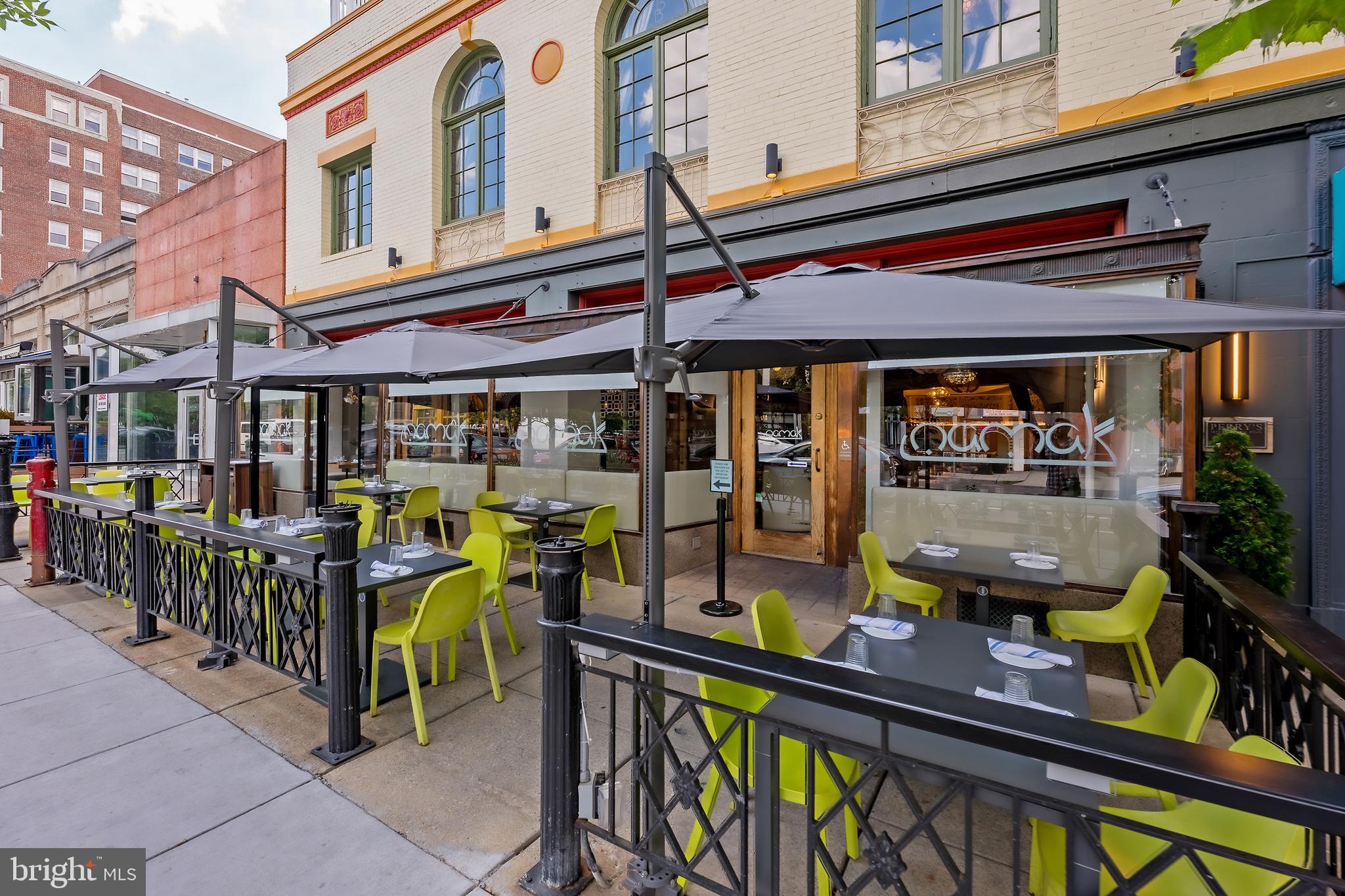 2853 Ontario Road Northwest, Unit 107 Washington, DC 20009 - Photo 34 of 39 a view of an outdoor sitting area with a table and chairs
