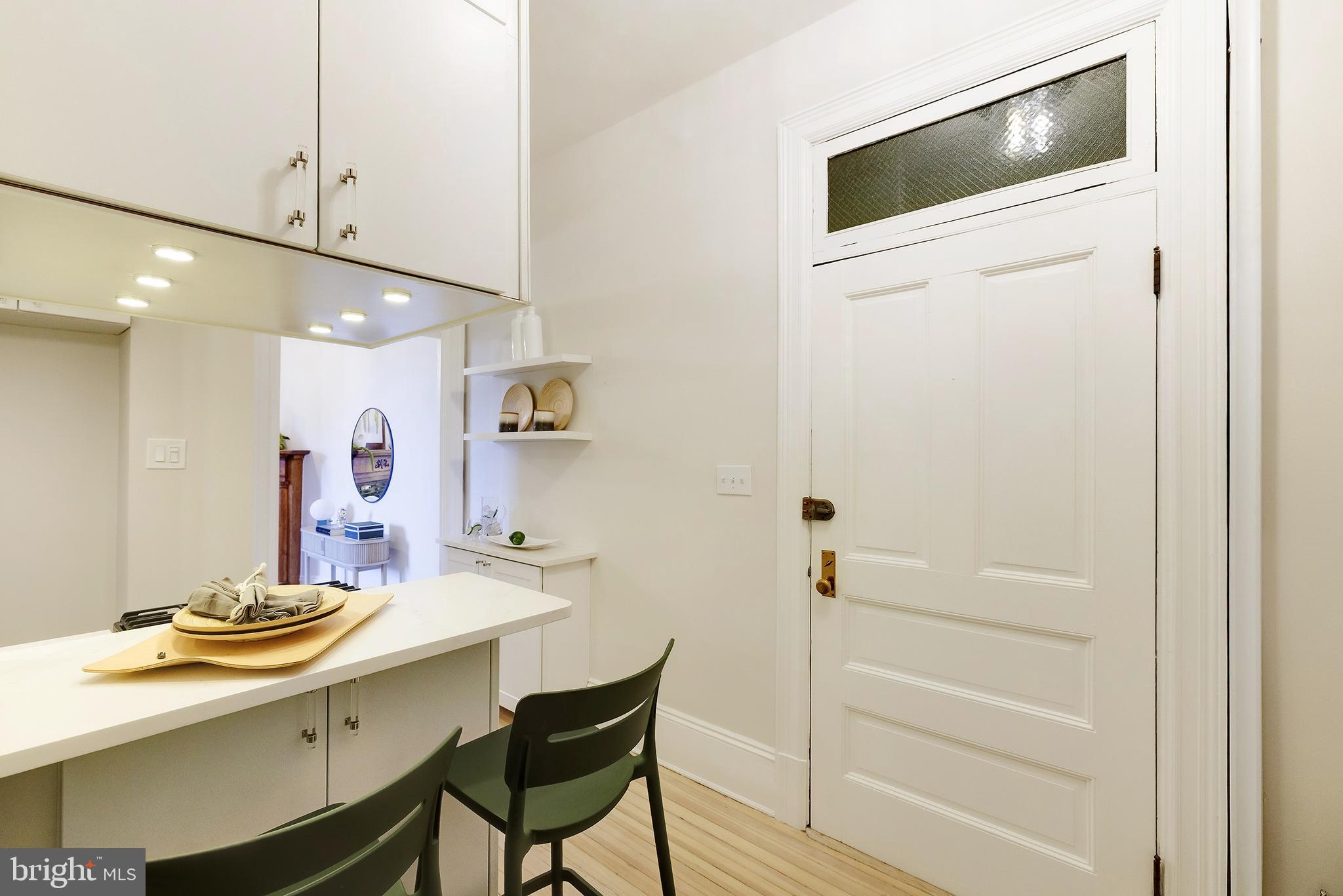 2853 Ontario Road Northwest, Unit 107 Washington, DC 20009 - Photo 8 of 39 a bathroom with a sink a mirror and a bathtub