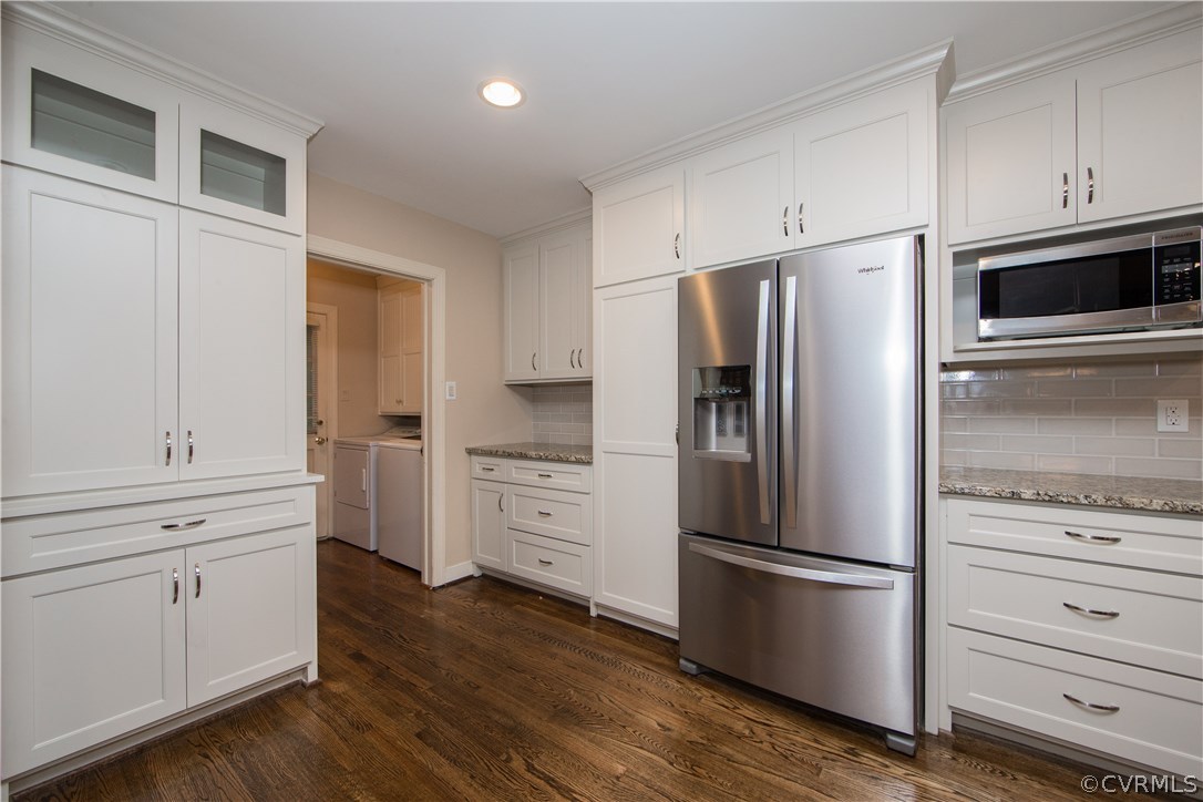 2729 West Brigstock Road Midlothian, VA 23113 - Photo 11 of 50 a kitchen with stainless steel appliances white cabinets and a refrigerator