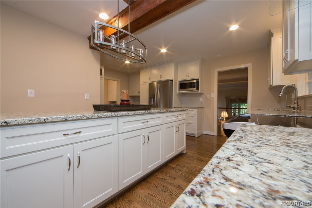2729 West Brigstock Road Midlothian, VA 23113 - Photo 13 of 50 a large kitchen with kitchen island a sink stainless steel appliances and cabinets