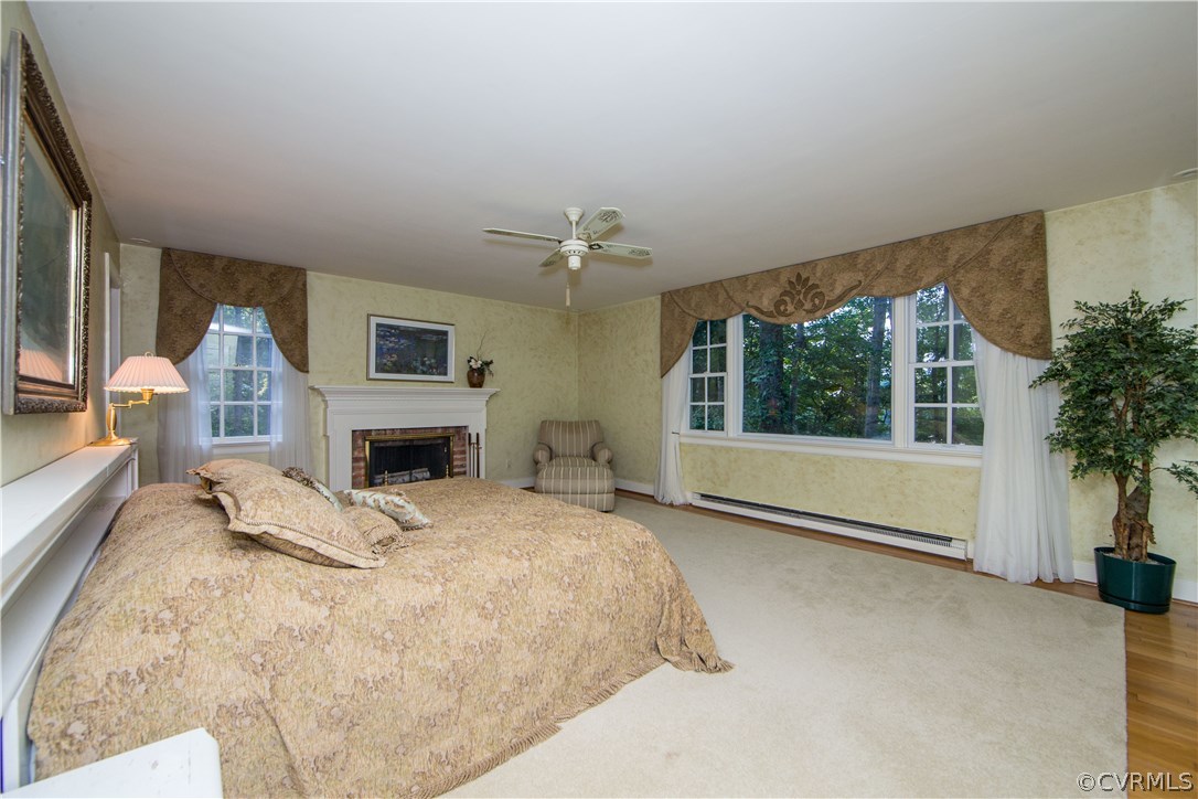 2729 West Brigstock Road Midlothian, VA 23113 - Photo 27 of 50 a view of a bedroom with furniture and a fireplace