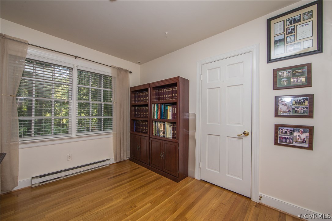 2729 West Brigstock Road Midlothian, VA 23113 - Photo 36 of 50 an empty room with wooden floor and windows