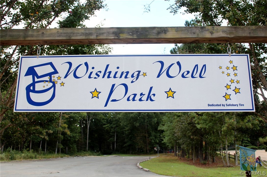 2729 West Brigstock Road Midlothian, VA 23113 - Photo 45 of 50 a view of outdoor space with signage and flags