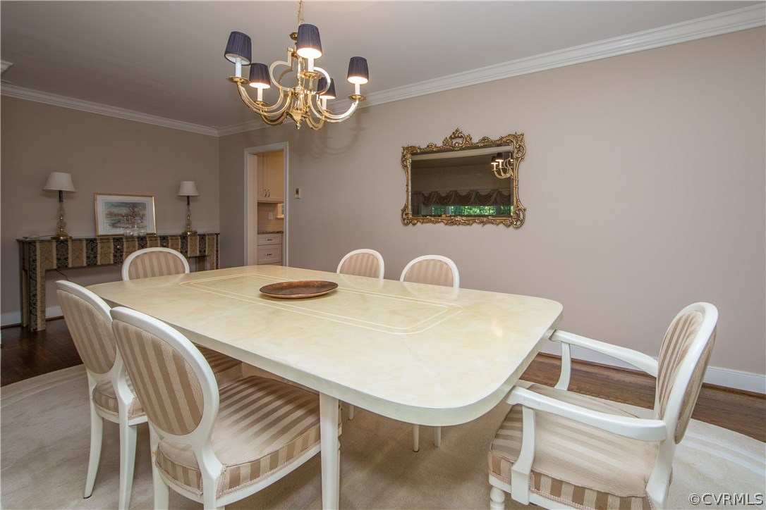 2729 West Brigstock Road Midlothian, VA 23113 - Photo 9 of 50 a view of a dining room with furniture and chandelier