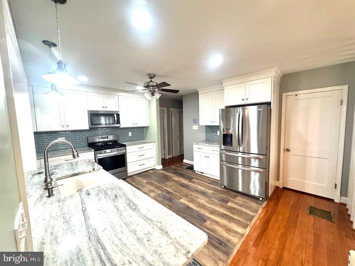 209 Mountain Road Linthicum Heights, MD 21090 - Photo 11 of 59 Modern kitchen with sleek finishes.