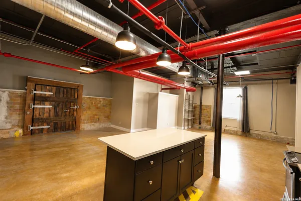 a kitchen with a refrigerator and a sink
