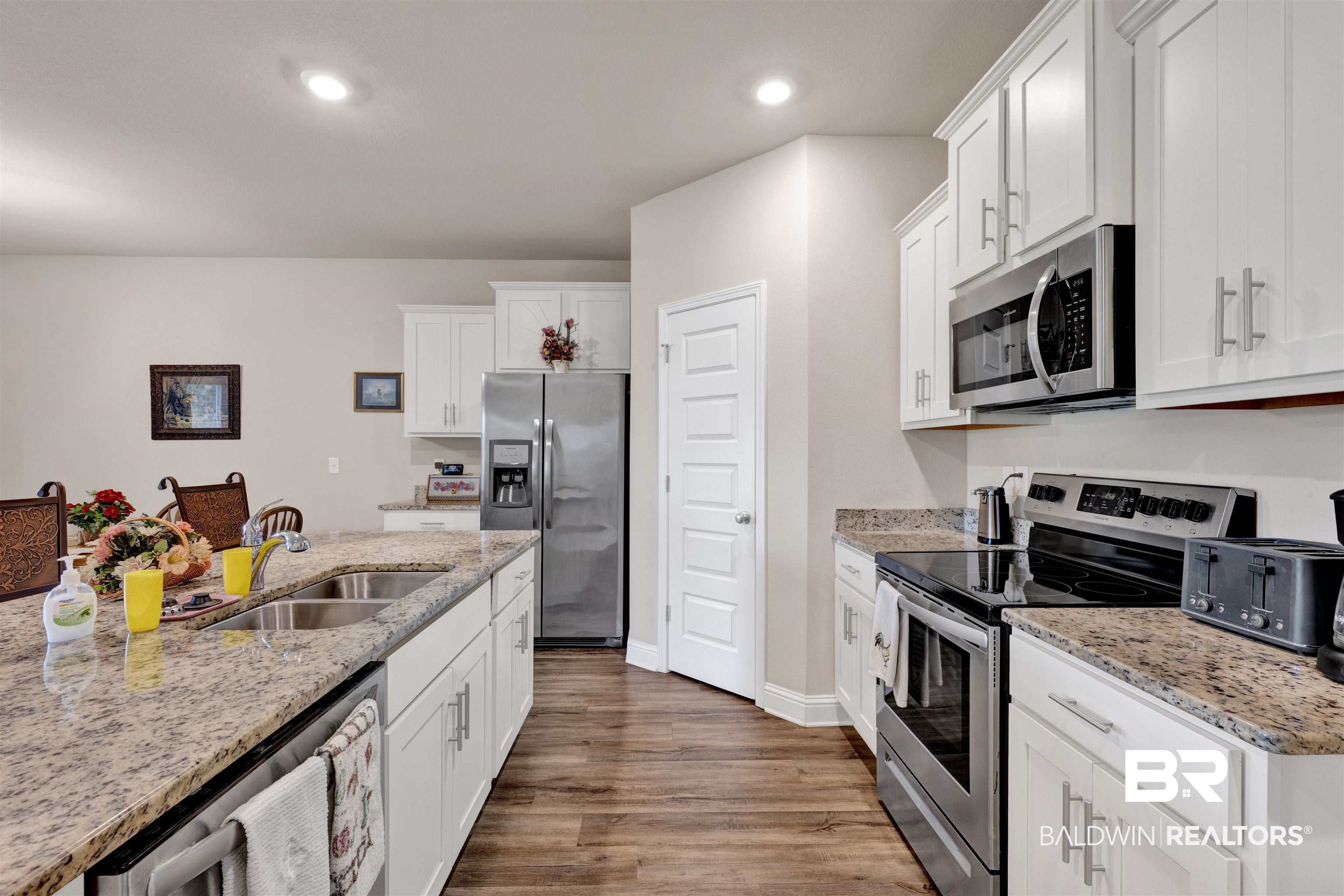 24812 Slater Mill Road Daphne, AL 36526 - Photo 5 of 31 Painted Cabinets w/ soft closed doors, granite countertops, stainless steel appliances & large island