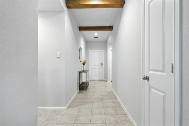 a view of a hallway with a white walls