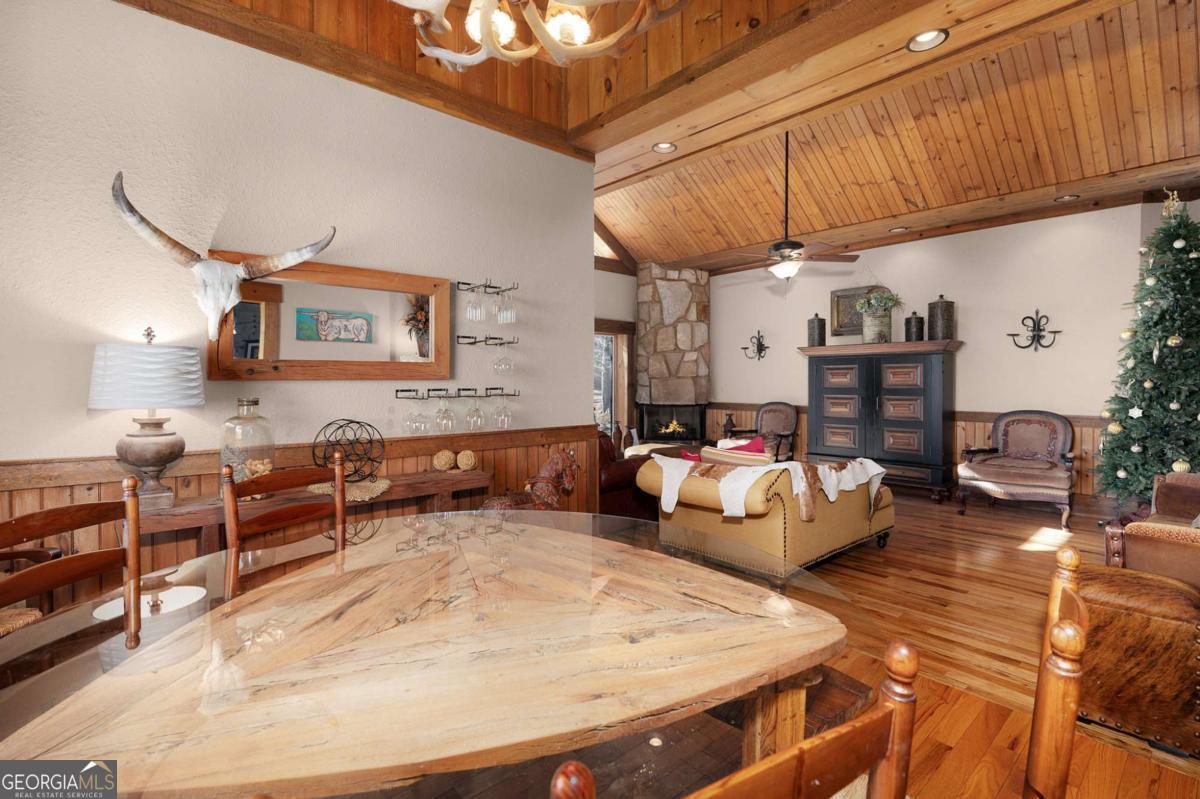 244 Tipton Court Cherry Log, GA 30522 - Photo 16 of 84 a living room with furniture and a wooden floor