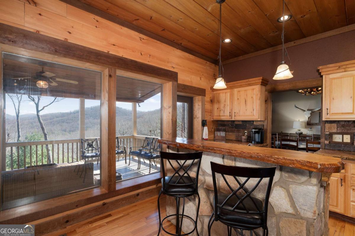 244 Tipton Court Cherry Log, GA 30522 - Photo 17 of 84 a view of a dining room with furniture window and wooden floor