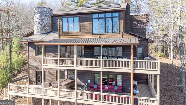 a view of a balcony with couch and wooden floor