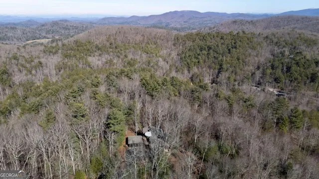 a living room with furniture and floor to ceiling window