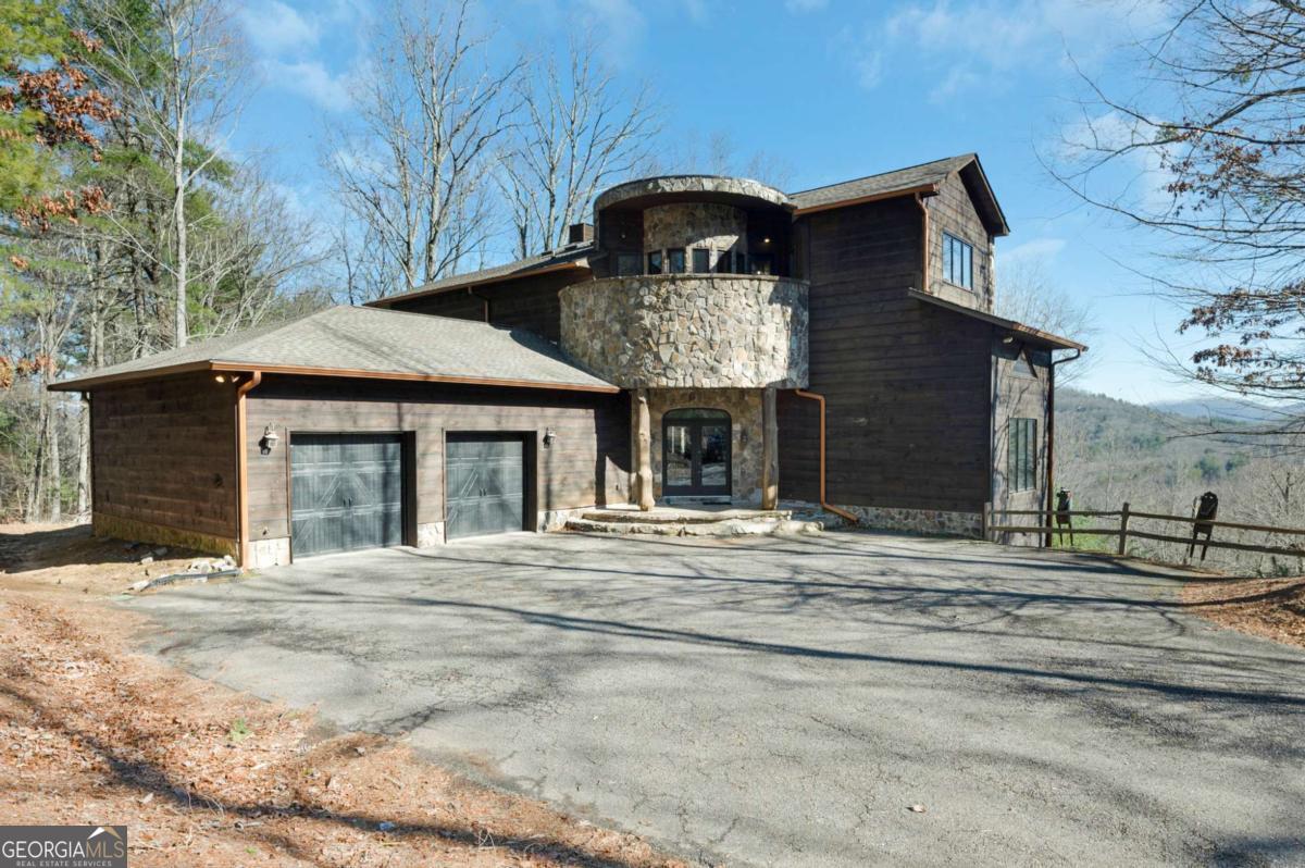 244 Tipton Court Cherry Log, GA 30522 - Photo 38 of 84 a front view of a house with a garden