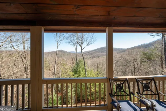 a bathroom with a granite countertop sink mirror vanity and toilet