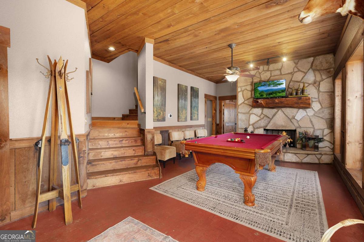 244 Tipton Court Cherry Log, GA 30522 - Photo 69 of 84 a room with lots of wooden furniture and a rug