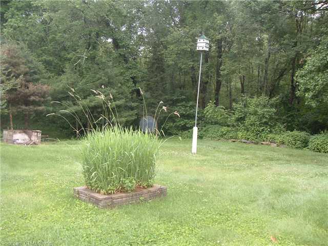 116 Lambtown Road Ledyard, CT 06339 - Photo 1 of 1 a backyard of a house with table and chairs