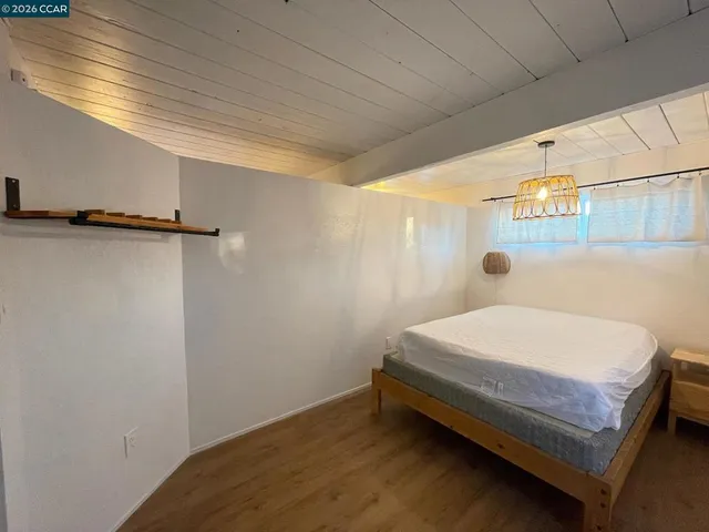a bathroom with a toilet mirror and vanity