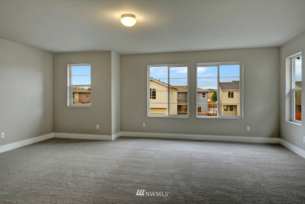 3527 178th Street Southeast, Unit 1032 Bothell, WA 98012 - Photo 5 of 15 an empty room with windows