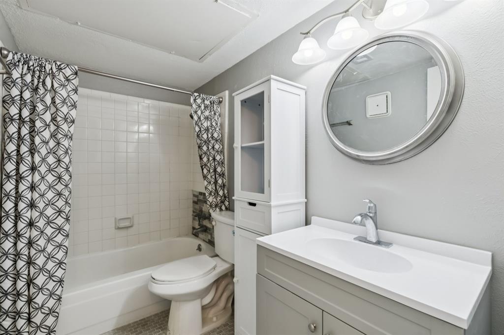 4748 Old Bent Tree Lane, Unit 1808 Dallas, TX 75287 - Photo 14 of 28 a bathroom with a sink toilet and shower