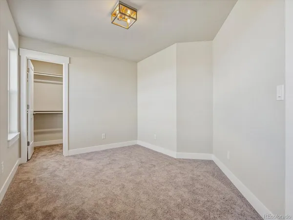 a view of an empty room and fire place
