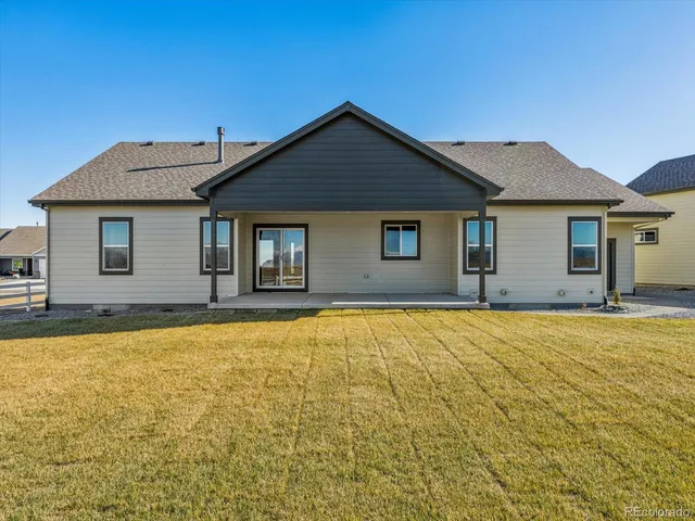 a front view of a house with yard