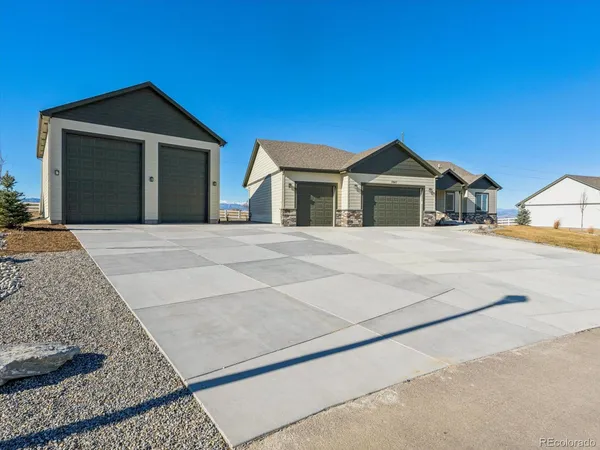 a front view of a house with a garage
