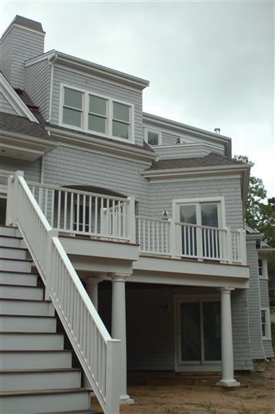 Undisclosed Address Mashpee, MA 02649 - Photo 7 of 18 a view of a house with wooden deck